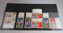 Load image into Gallery viewer, 1969 CHRISTMAS STAMPS X 8 MNH WITH EDGES IN CLEAR FRONTED STAMP HOLDER
