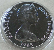 Load image into Gallery viewer, 1983 QUEEN ELIZABETH II COOK ISLANDS ONE DOLLAR COIN PRESENTED IN CLEAR CAPSULE
