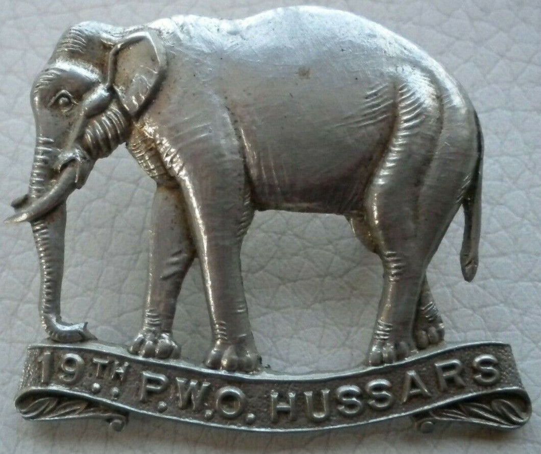 19TH P.O.W. HUSSARS WHITE METAL MILITARY CAP BADGE