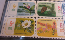 Load image into Gallery viewer, 1960&#39;S &amp; 1970&#39;S USA 12 X STAMPS MNH IN A CLEAR FRONTED STAMP HOLDER

