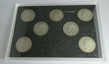 Load image into Gallery viewer, FLORIN SET OF SEVEN SILVER COINS IN CLEAR HARD CASE &amp; ROYAL MINT BLUE BOOK
