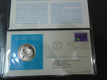 Load image into Gallery viewer, 1975 - 77 UNITED NATIONS OFFICIAL SILVER PROOF MEDAL COVER WITH STAMPS IN SLEAVE
