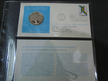 Load image into Gallery viewer, 1975 - 77 UNITED NATIONS OFFICIAL SILVER PROOF MEDAL COVER WITH STAMPS IN SLEAVE
